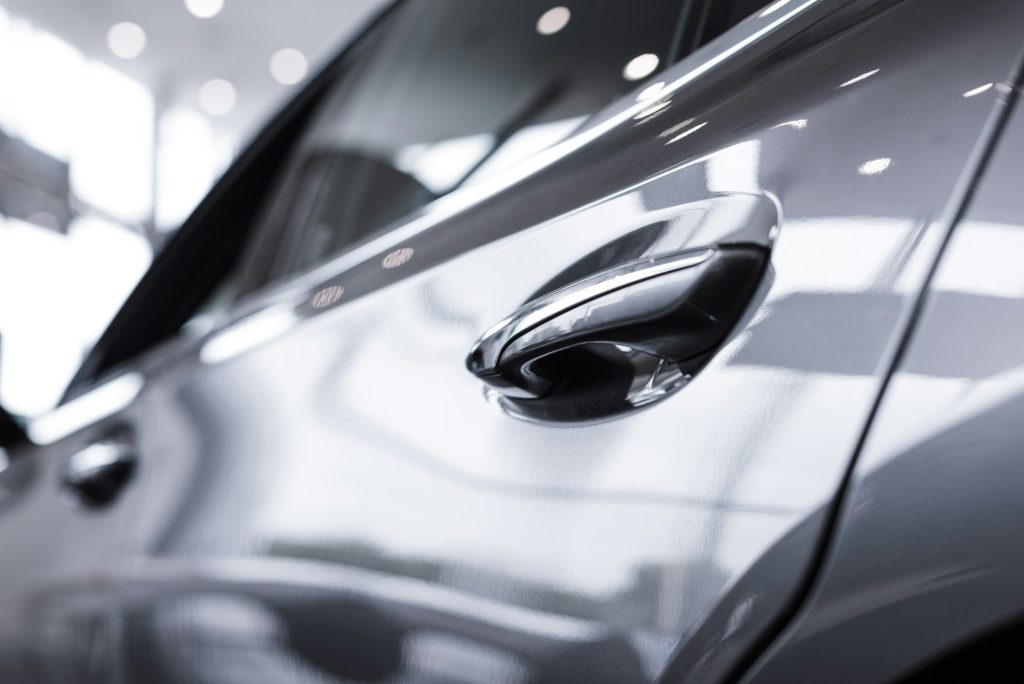 close up view of luxury shiny car in auto salon