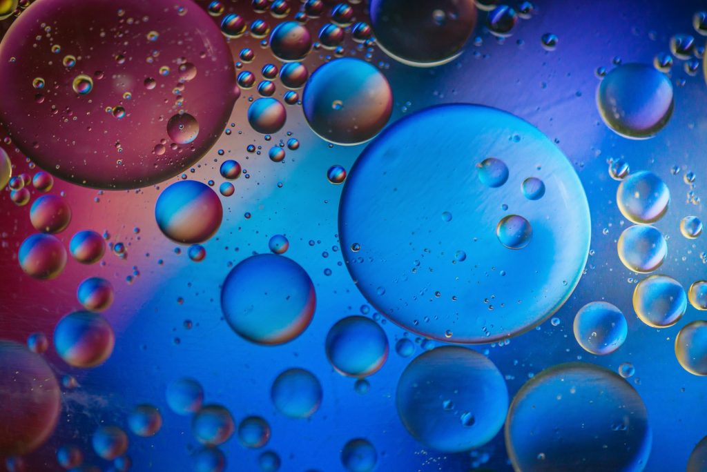 Multicolored abstract defocused background picture made with oil, water and soap